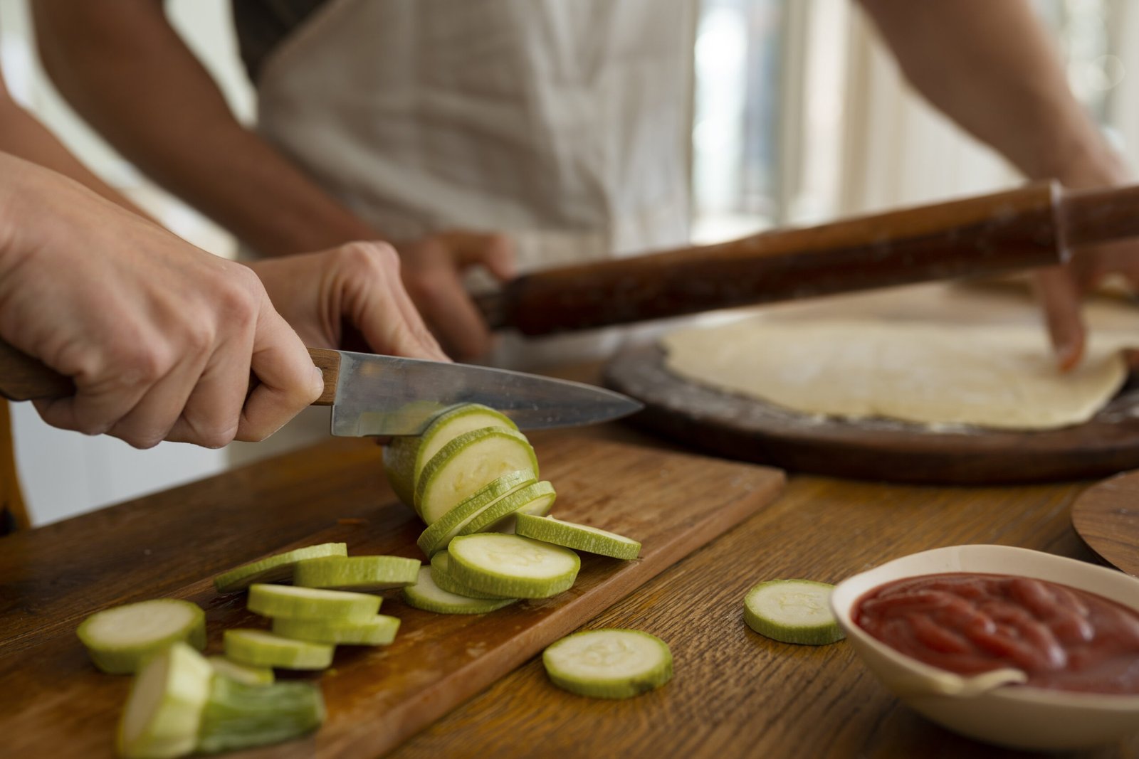 front-view-cook-preparing-pizza