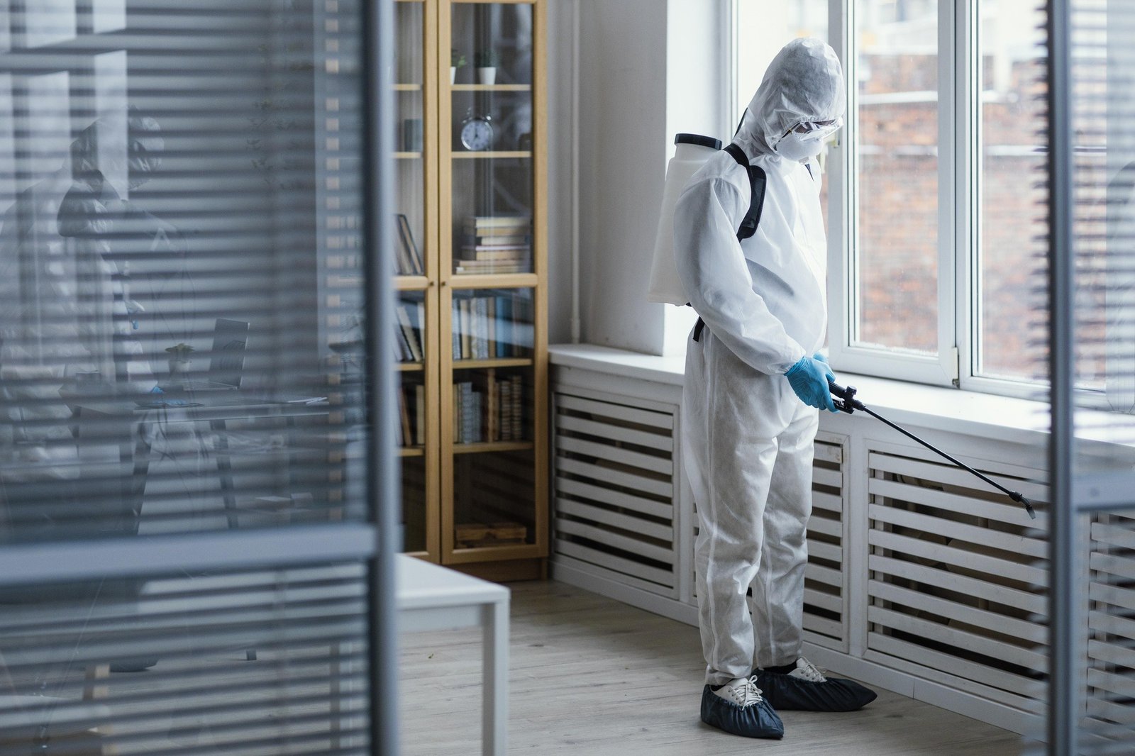 people-disinfecting-biohazard-area