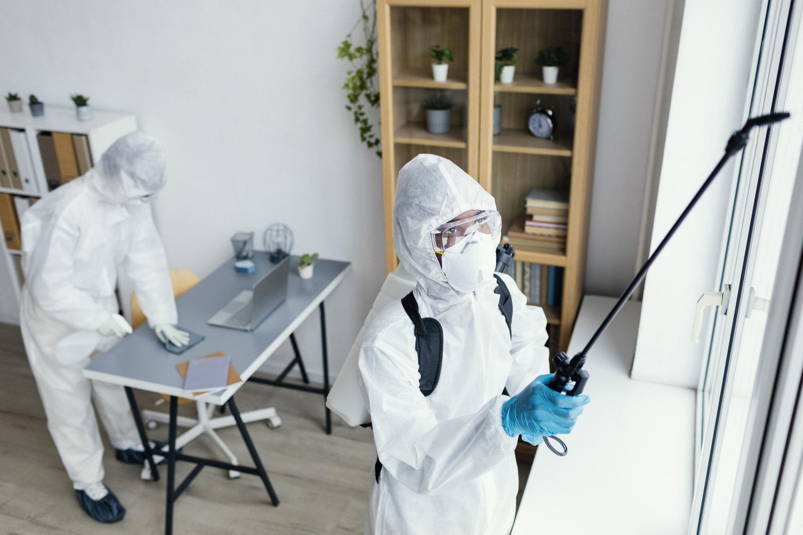 people-disinfecting-together-dangerous-area